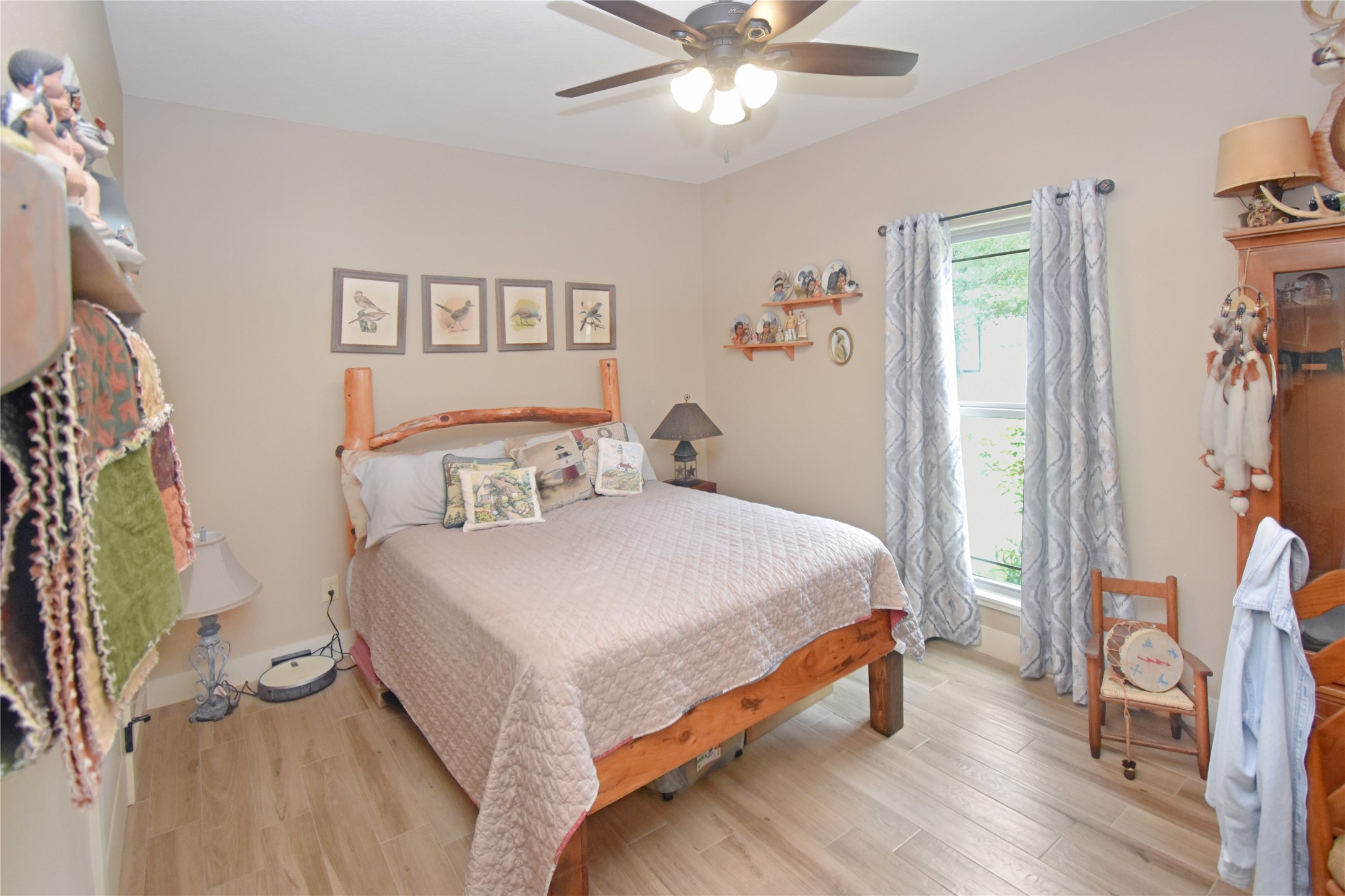 115 Pr 5250 Warren, TX 77664 - Photo 9 of 21 a bedroom with a bed and a chandelier