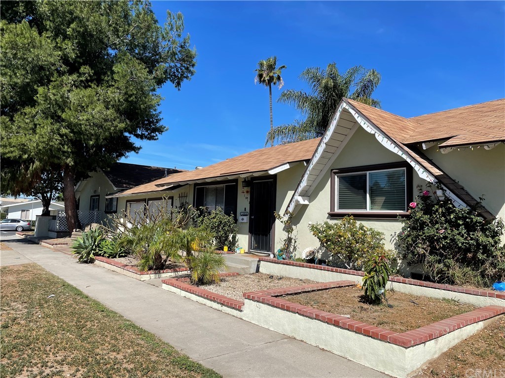 305 North Oak Street Orange, CA 92867 - Photo 1 of 1 a front view of a house with garden