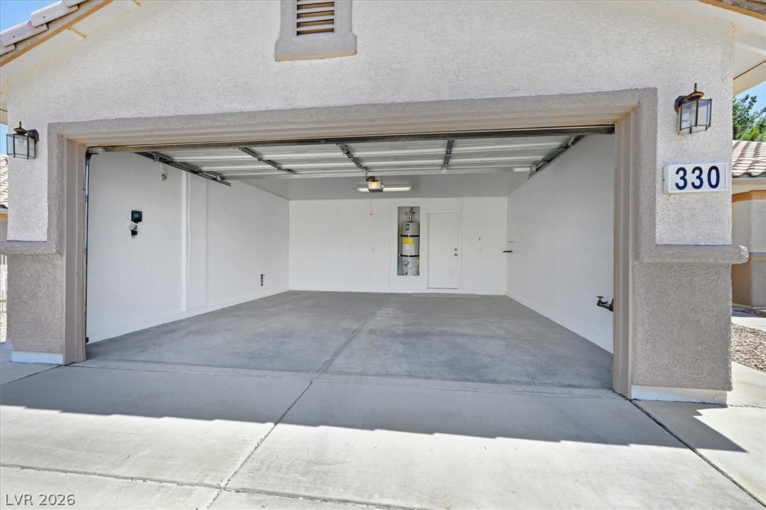 330 Warm Front Street Henderson, NV 89014 - Photo 21 of 25 This spacious garage offers ample storage and utility space.