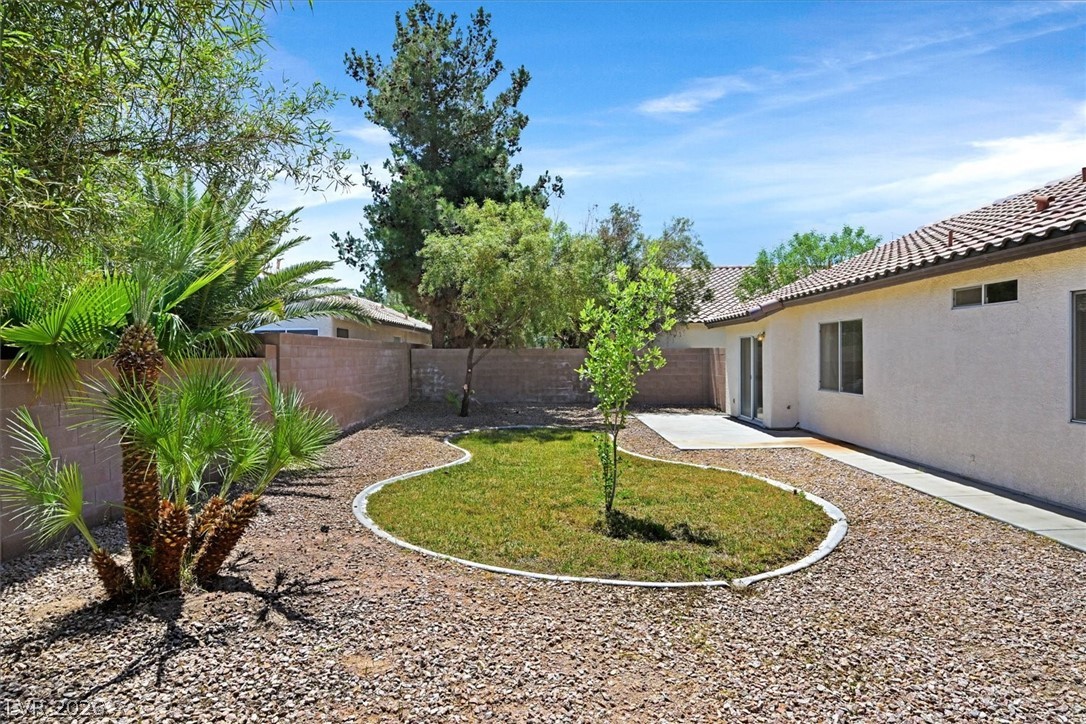 330 Warm Front Street Henderson, NV 89014 - Photo 23 of 25 This spacious yard offers a serene retreat with ample space for outdoor enjoyment.