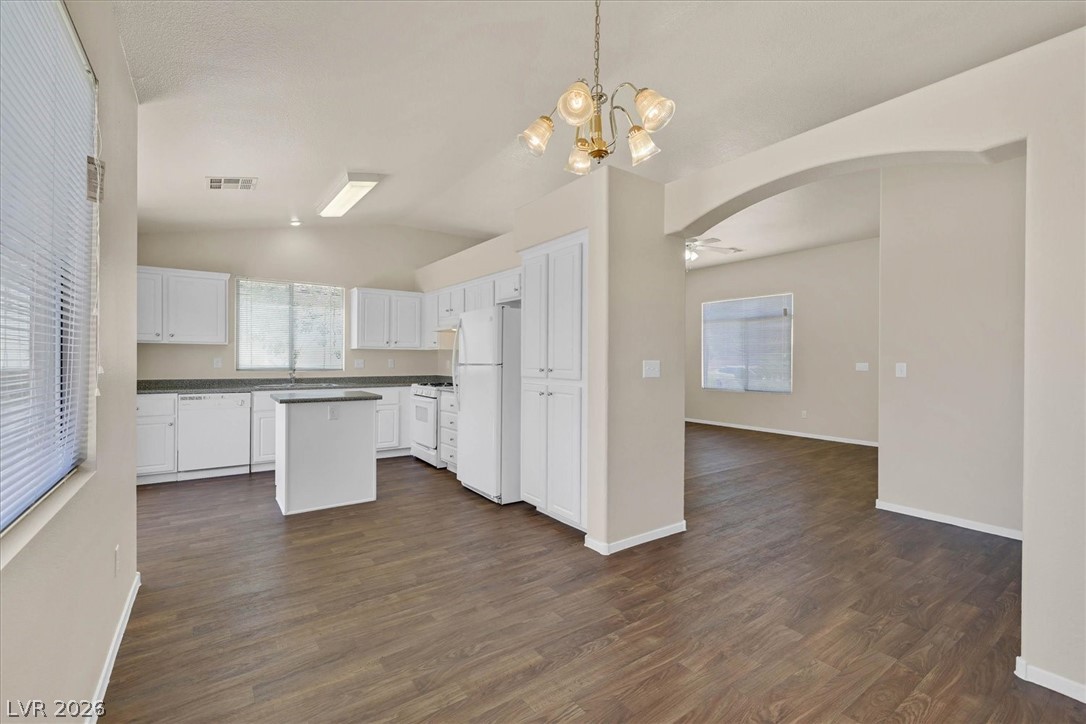 330 Warm Front Street Henderson, NV 89014 - Photo 6 of 25 Bright and open-concept kitchen features a functional island and durable flooring.