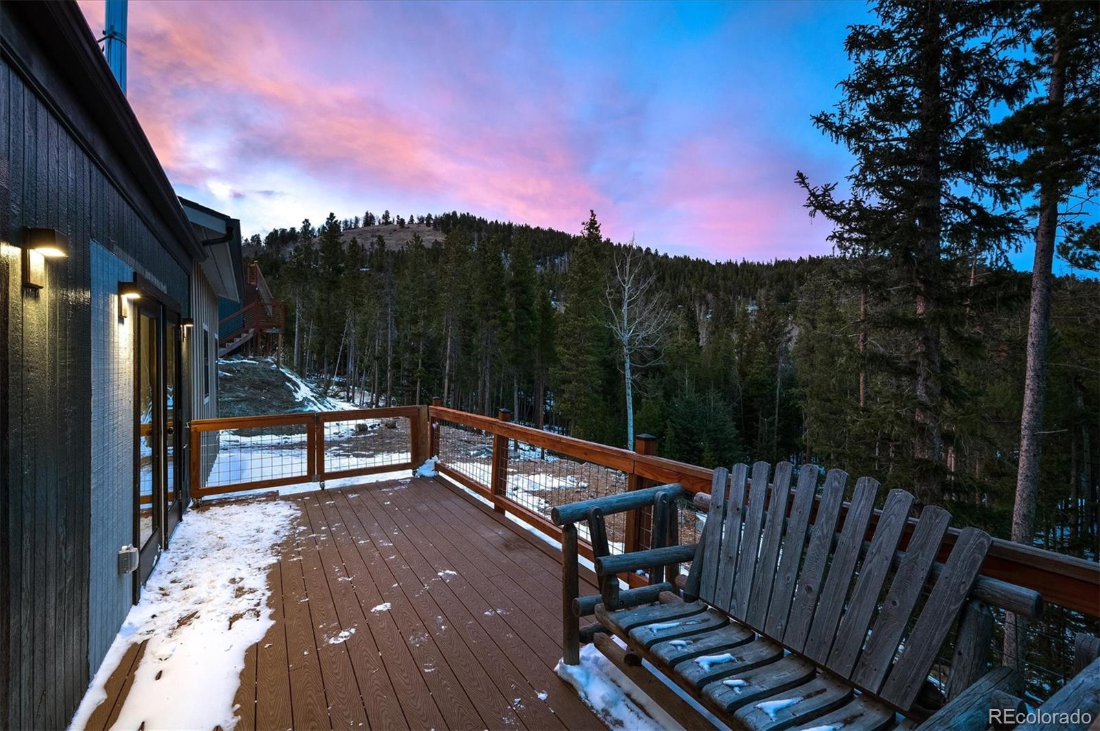 1633 Sinton Road Evergreen, CO 80439 - Photo 36 of 39 a view of a terrace with trees