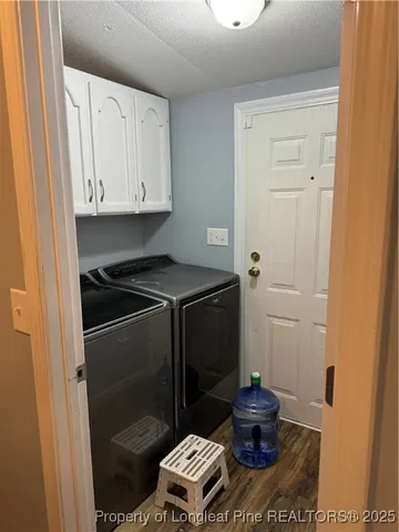 a bed sitting in a room next to a window