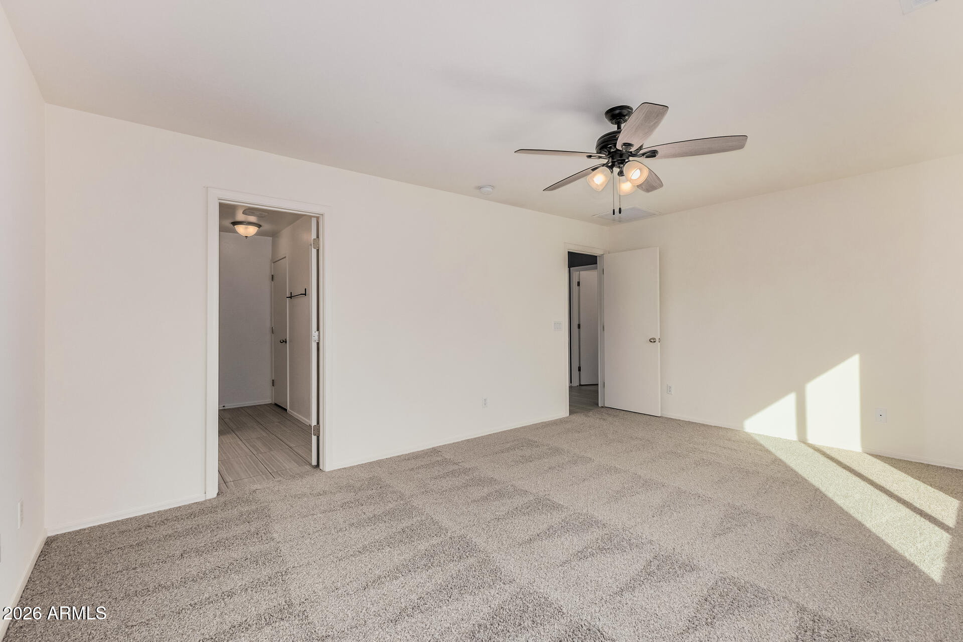 1877 West Rd Agent Street Apache Junction, AZ 85120 - Photo 13 of 24 a view of a room with a ceiling fan and a window