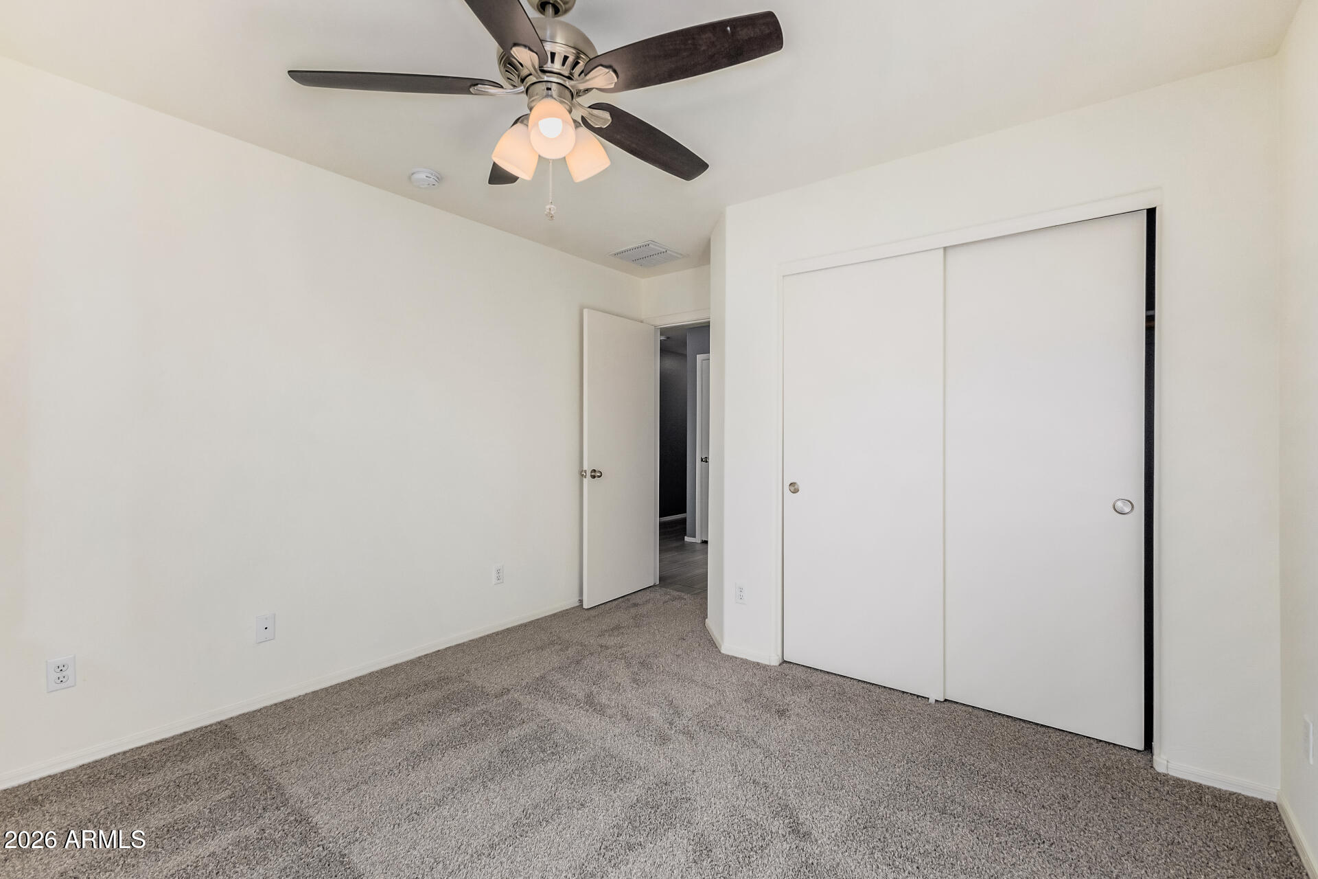1877 West Rd Agent Street Apache Junction, AZ 85120 - Photo 17 of 24 an empty room with closet and a chandelier fan