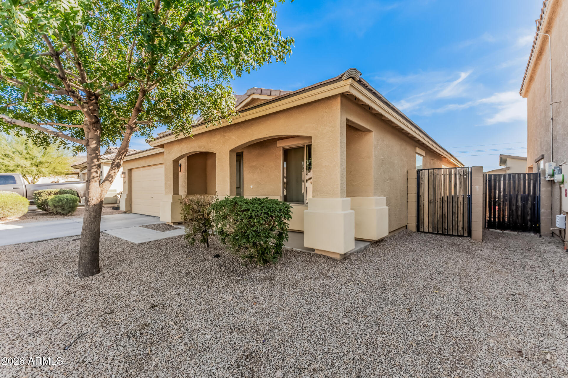 1877 West Rd Agent Street Apache Junction, AZ 85120 - Photo 2 of 24 a view of a house with backyard and trees