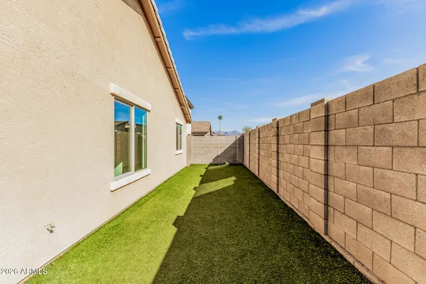 a view of a backyard with white house