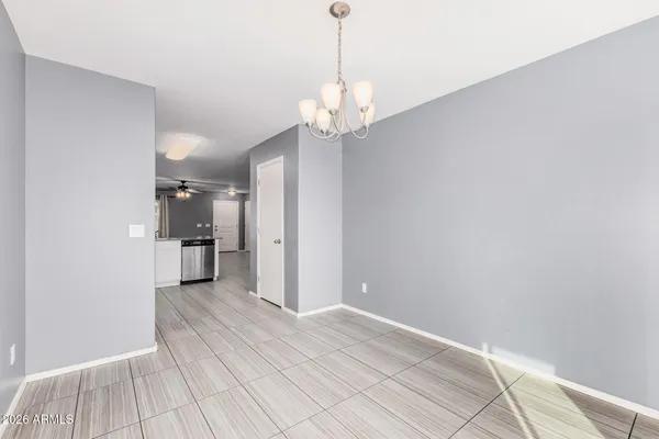 a view of a kitchen with a sink and a chandelier