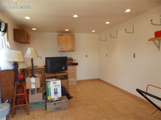 6375 Bismark Road Colorado Springs, CO 80922 - Photo 23 of 24 Interior of workshop features recessed lighting and is fully finished.