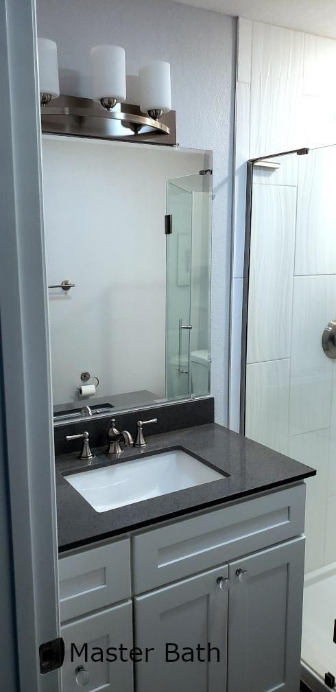 1481 Dutch Valley Road Clinton, TN 37716 - Photo 11 of 24 a bathroom with a sink and a mirror