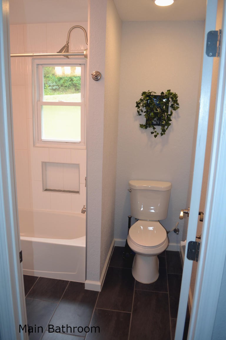 1481 Dutch Valley Road Clinton, TN 37716 - Photo 16 of 24 a bathroom with a toilet and a sink