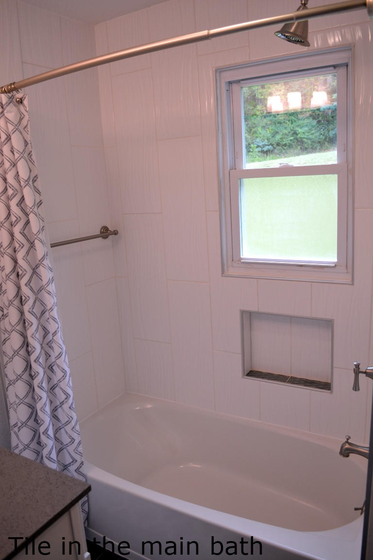 1481 Dutch Valley Road Clinton, TN 37716 - Photo 18 of 24 a bathroom with a shower and a bathtub
