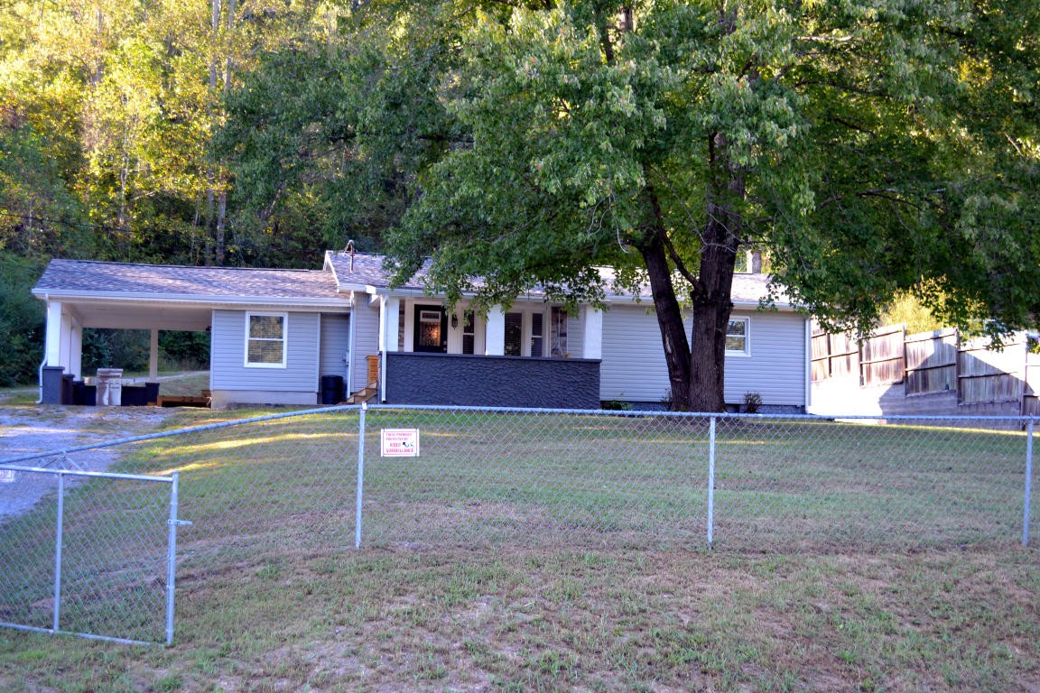1481 Dutch Valley Road Clinton, TN 37716 - Photo 2 of 24 a view of a house with a backyard