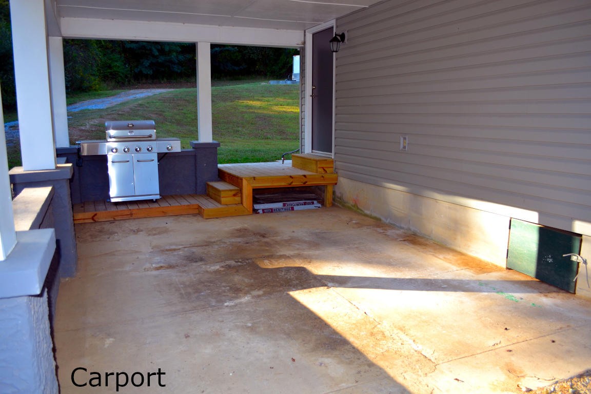 1481 Dutch Valley Road Clinton, TN 37716 - Photo 22 of 24 a backyard of a house with outdoor seating