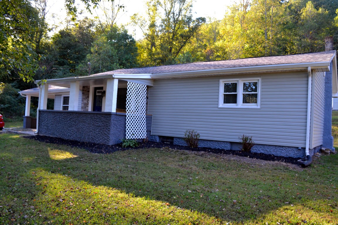 1481 Dutch Valley Road Clinton, TN 37716 - Photo 24 of 24 a front view of a house with garden