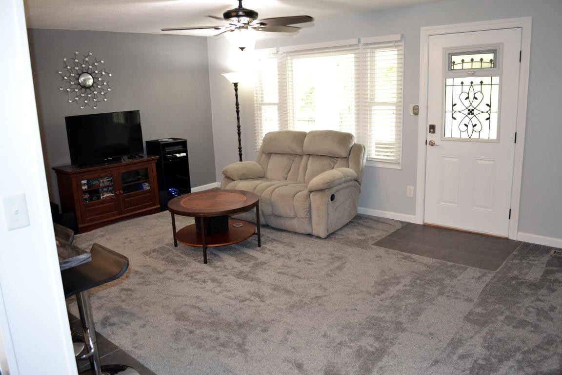 1481 Dutch Valley Road Clinton, TN 37716 - Photo 3 of 24 a living room with furniture and a flat screen tv