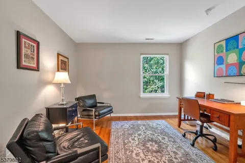 a workspace with furniture and window