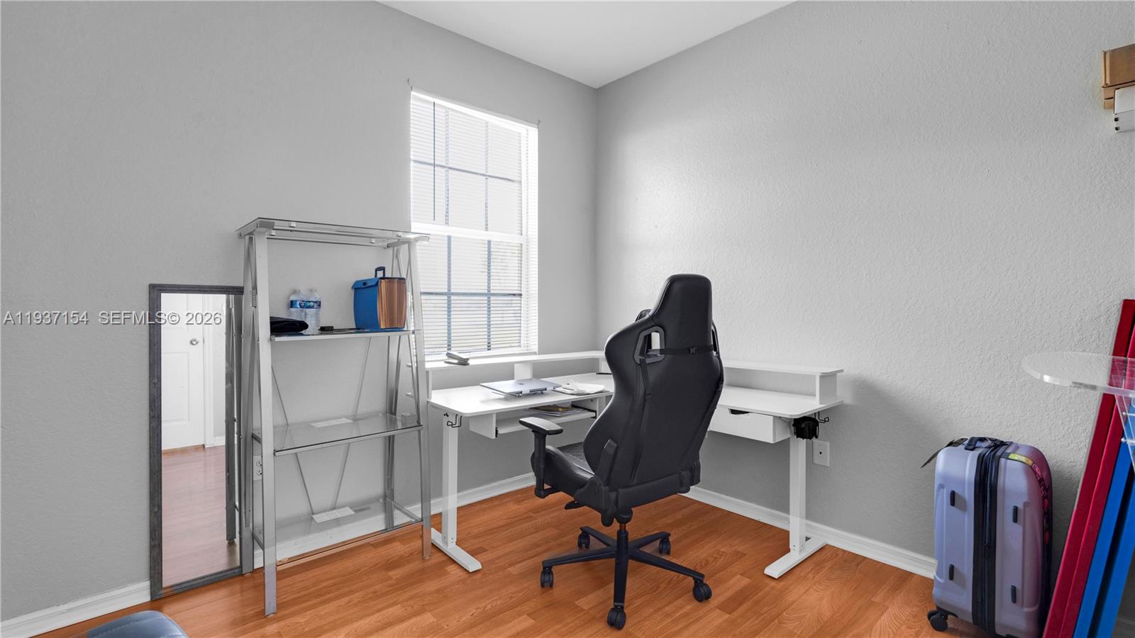 13103 Southwest 42nd Street, Unit 5106 Miramar, FL 33027 - Photo 19 of 35 a view of a workspace with furniture and a window