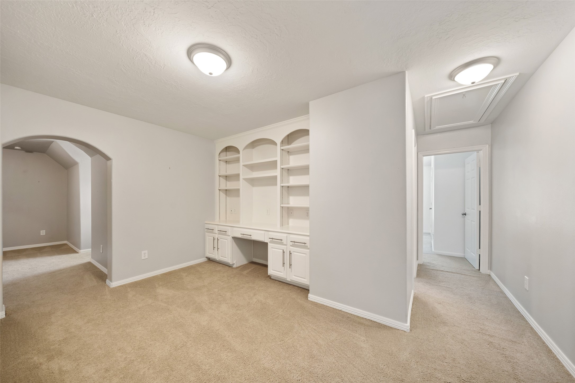 2302 Legends Shore Drive Spring, TX 77386 - Photo 35 of 48 Flexible bonus room with built-in shelving and workspace, perfect for studying, crafting, or working from home.