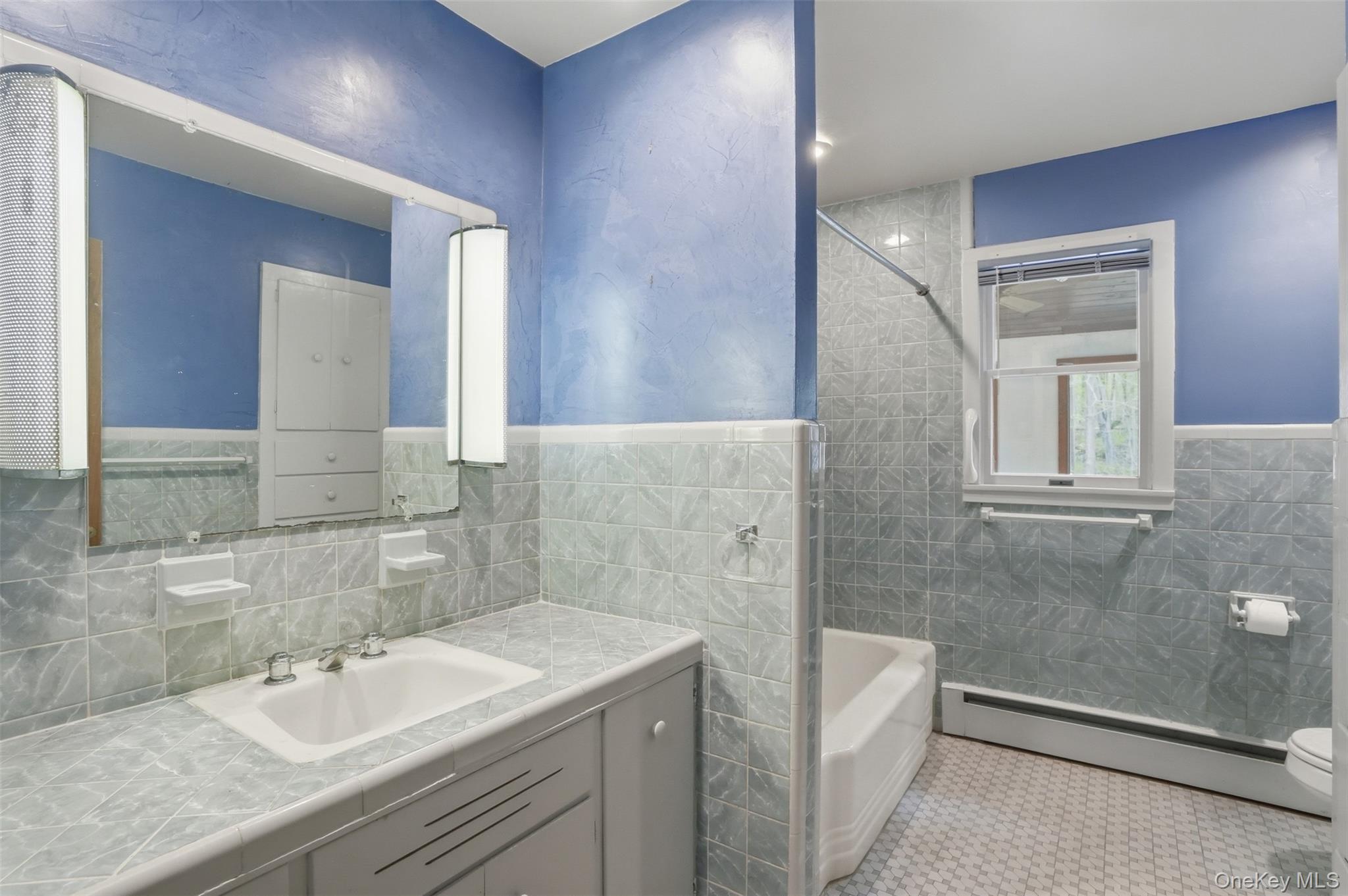 435 Samsonville Road Kerhonkson, NY 12446 - Photo 20 of 37 a bathroom with a sink a toilet and shower