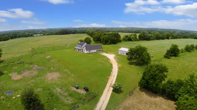 a view of a lake with a yard