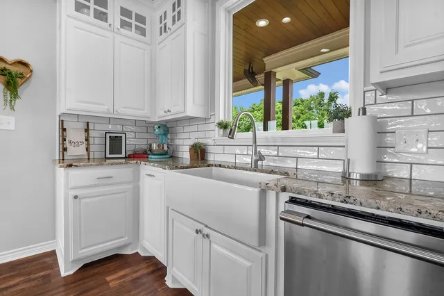 a kitchen with a sink and cabinets