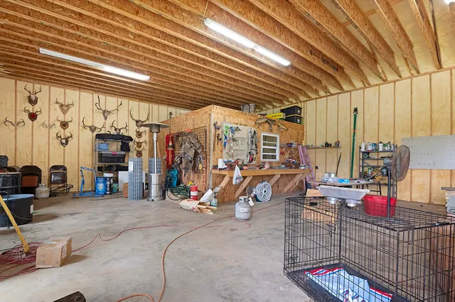 a view of a garage with rack and bicycle