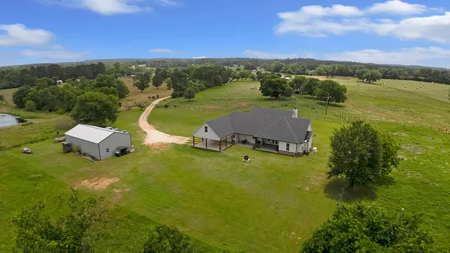 an aerial view of a house with a garden