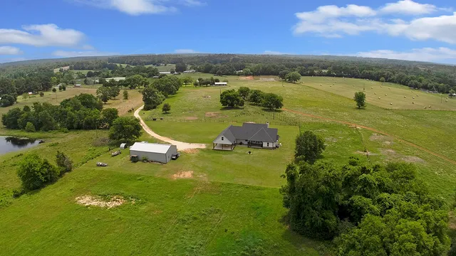 a view of a lake with a yard