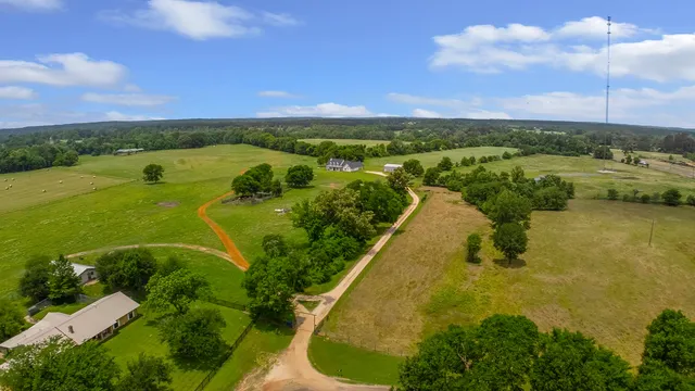 a view of a lake in front of house with a yard