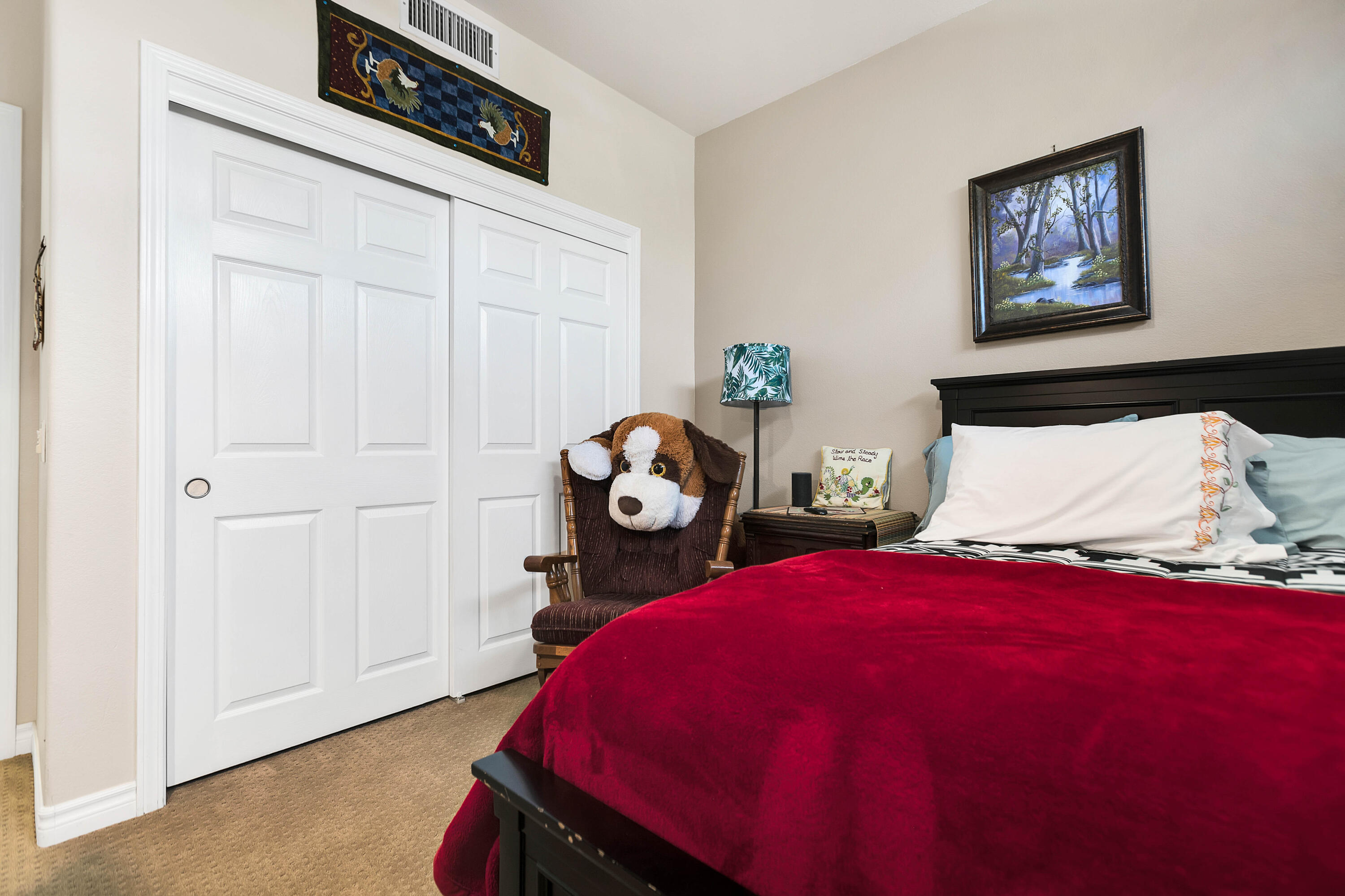 78386 Moongold Road Palm Desert, CA 92211 - Photo 27 of 43 a bedroom with a bed and a chandelier