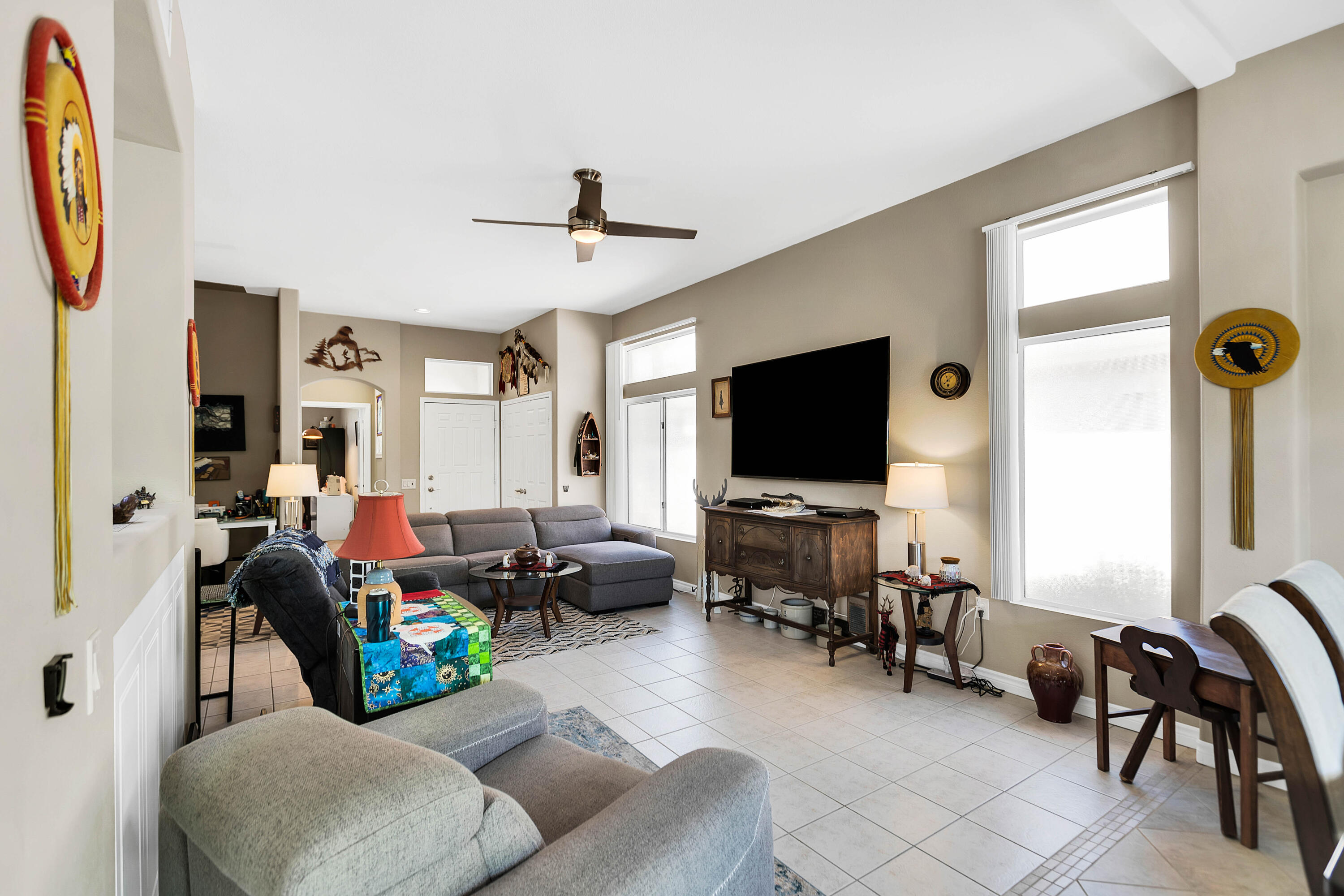 78386 Moongold Road Palm Desert, CA 92211 - Photo 28 of 43 a living room with furniture and a flat screen tv
