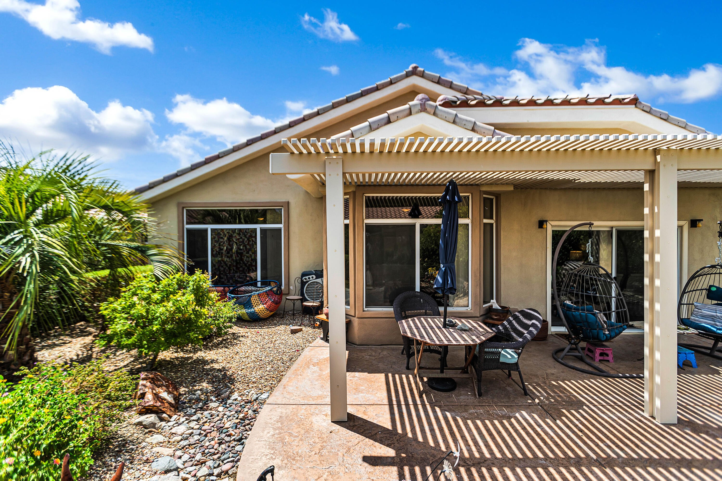 78386 Moongold Road Palm Desert, CA 92211 - Photo 4 of 43 a view of a house with a patio