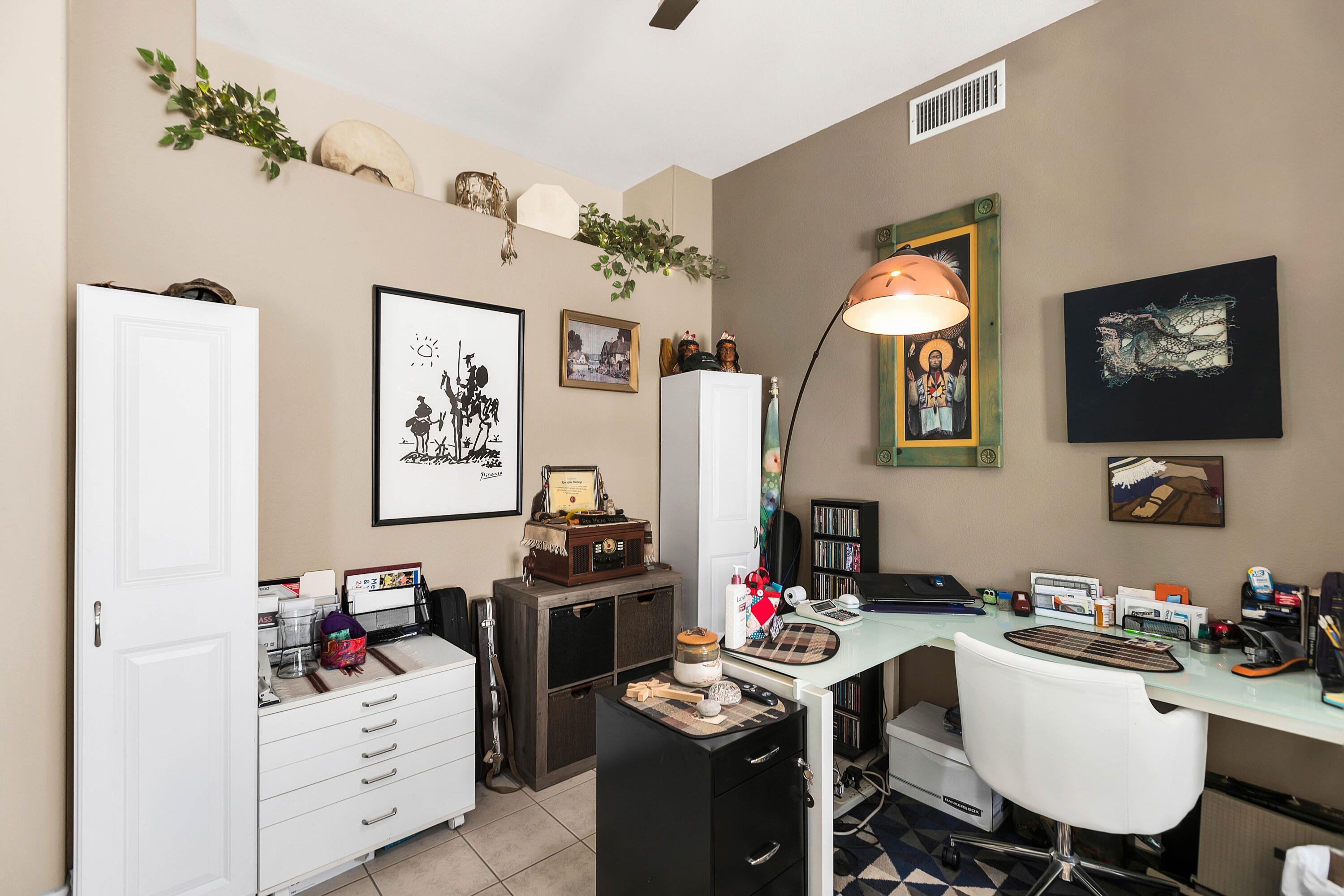 78386 Moongold Road Palm Desert, CA 92211 - Photo 7 of 43 a view of a workspace with furniture and a livingroom
