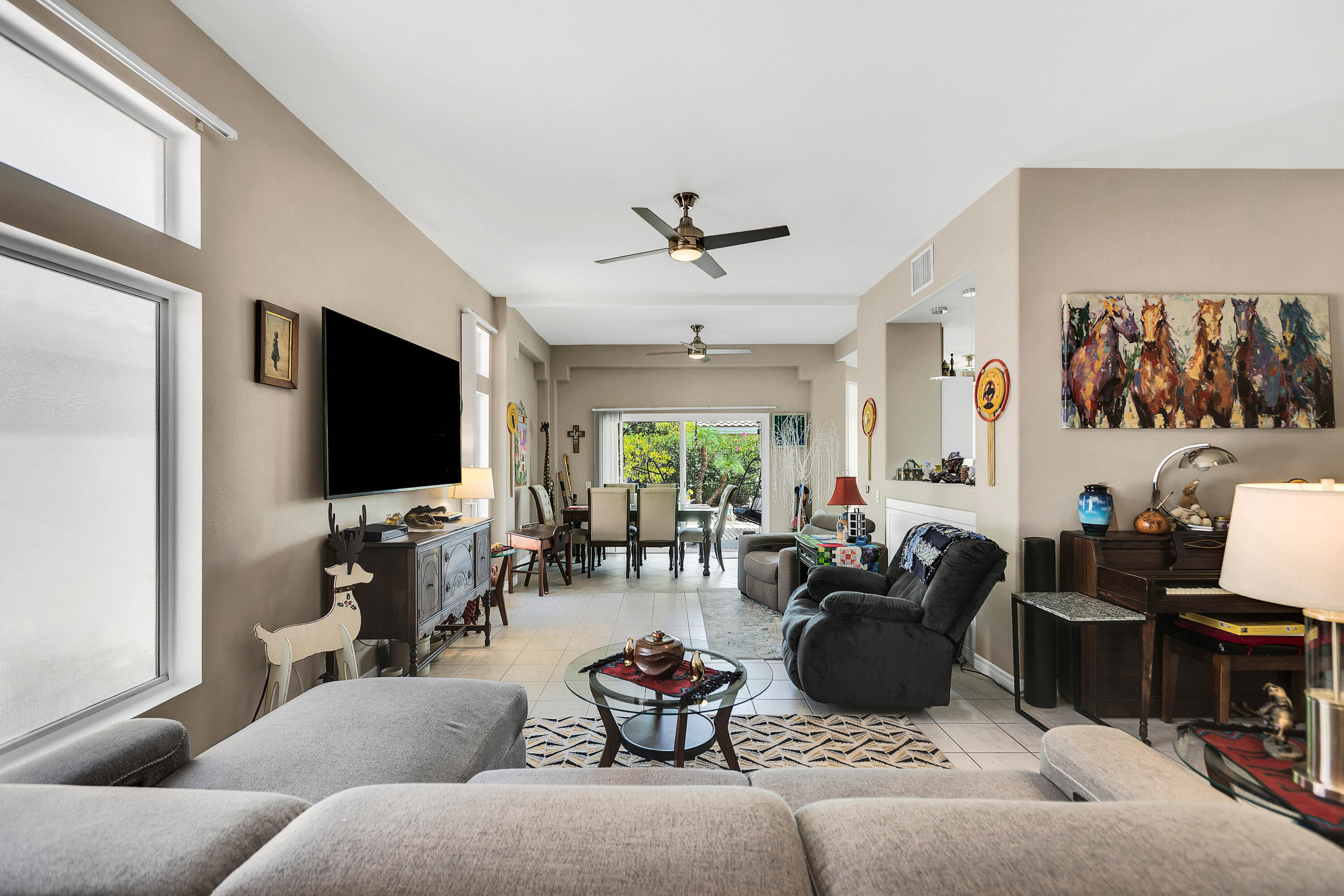78386 Moongold Road Palm Desert, CA 92211 - Photo 9 of 43 a living room with furniture and a flat screen tv