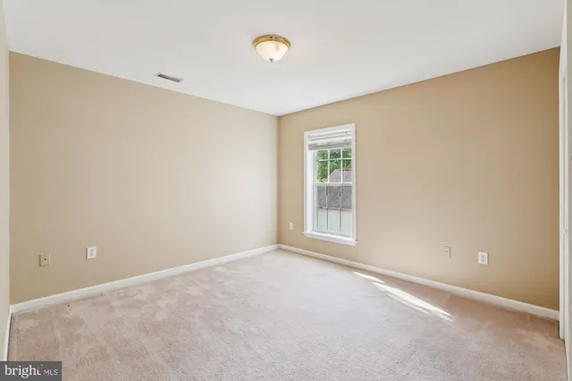 an empty room with a empty space and a window