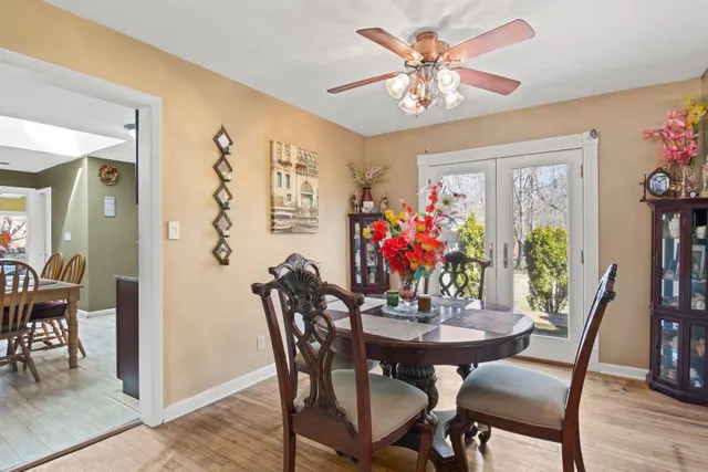 a view of a dining room with furniture and chandelier