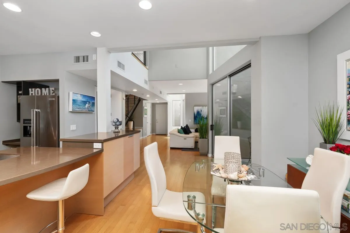 714 Bonair Way La Jolla, CA 92037 - Photo 13 of 36 a living room with furniture a dining table and a potted plant