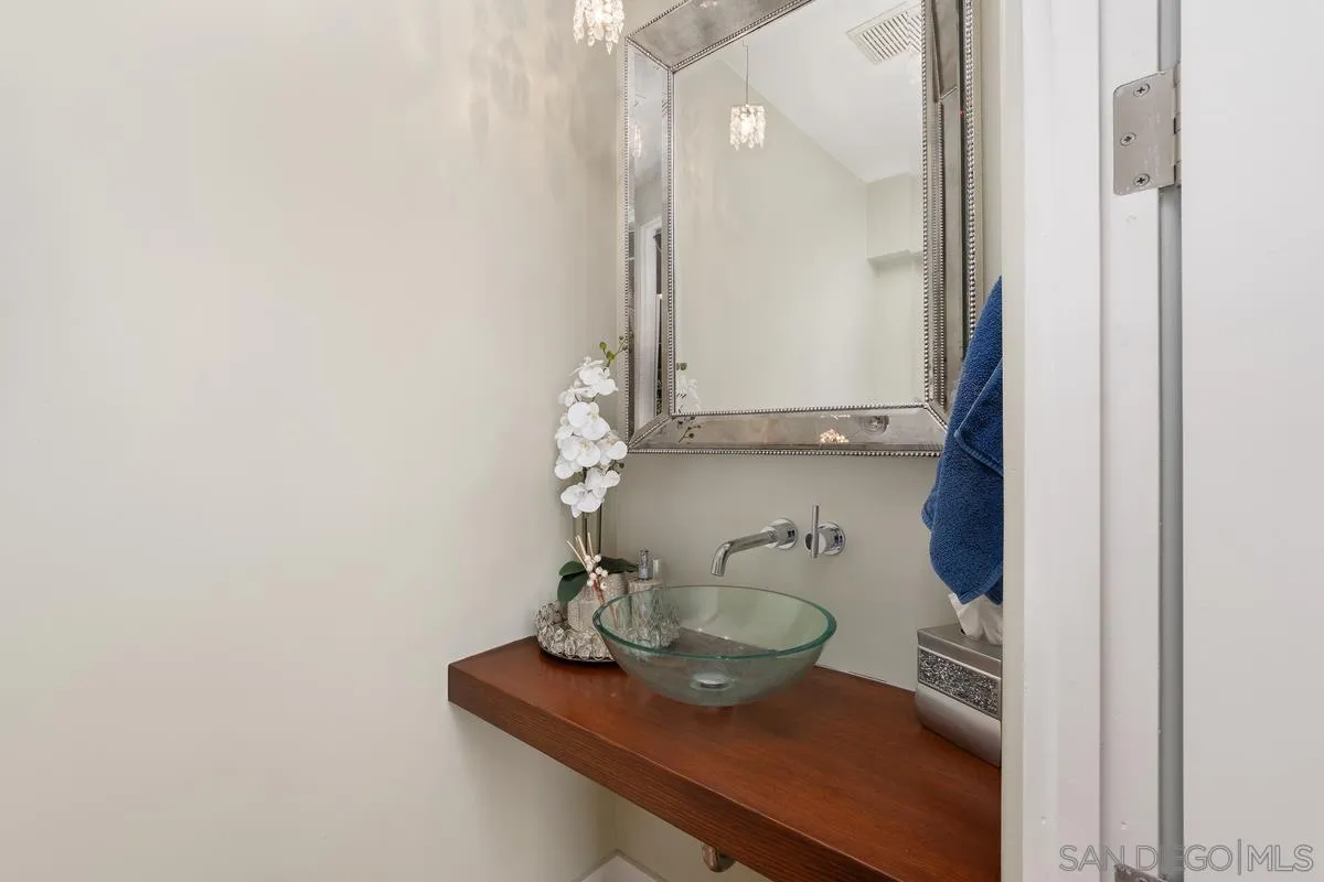 714 Bonair Way La Jolla, CA 92037 - Photo 18 of 36 a bathroom with a sink and a mirror