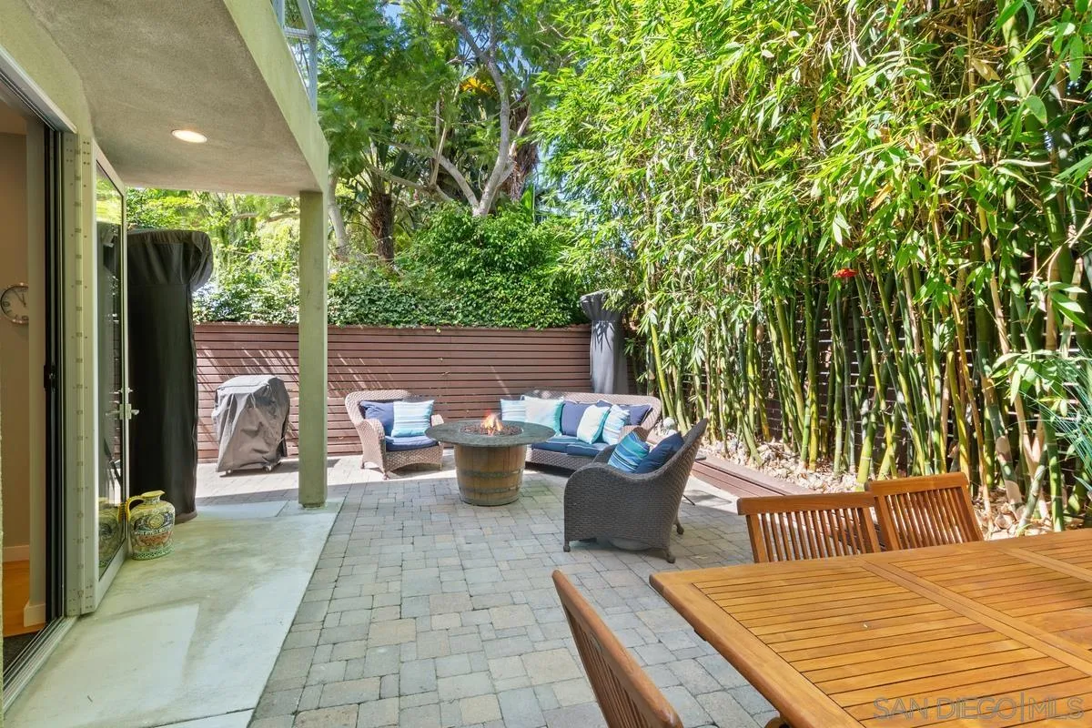 714 Bonair Way La Jolla, CA 92037 - Photo 21 of 36 a view of a patio with dining table and chairs