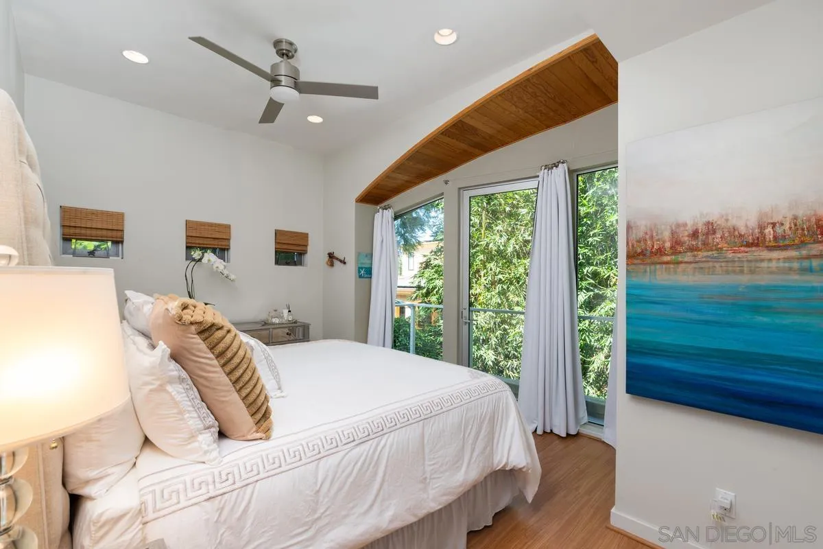 714 Bonair Way La Jolla, CA 92037 - Photo 25 of 36 a bed sitting in a bedroom next to a window