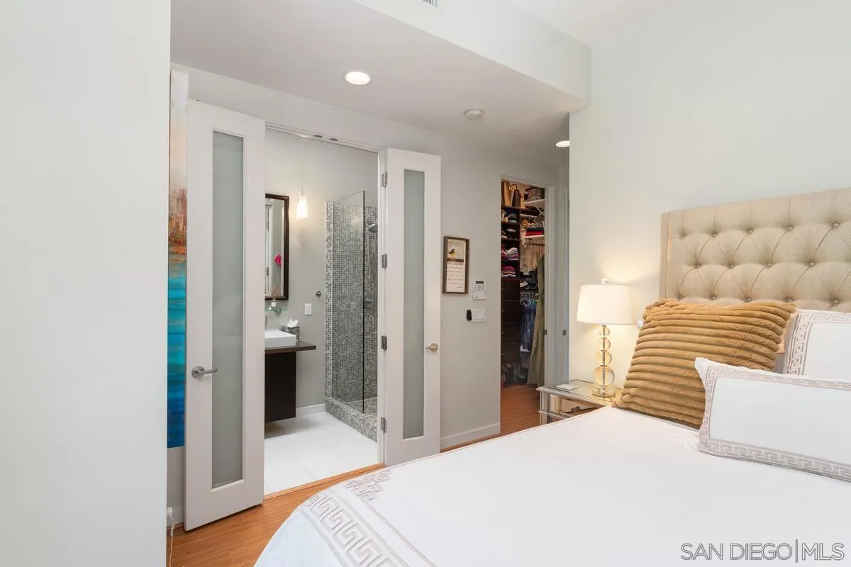 714 Bonair Way La Jolla, CA 92037 - Photo 26 of 36 a bedroom with a bed and a couch