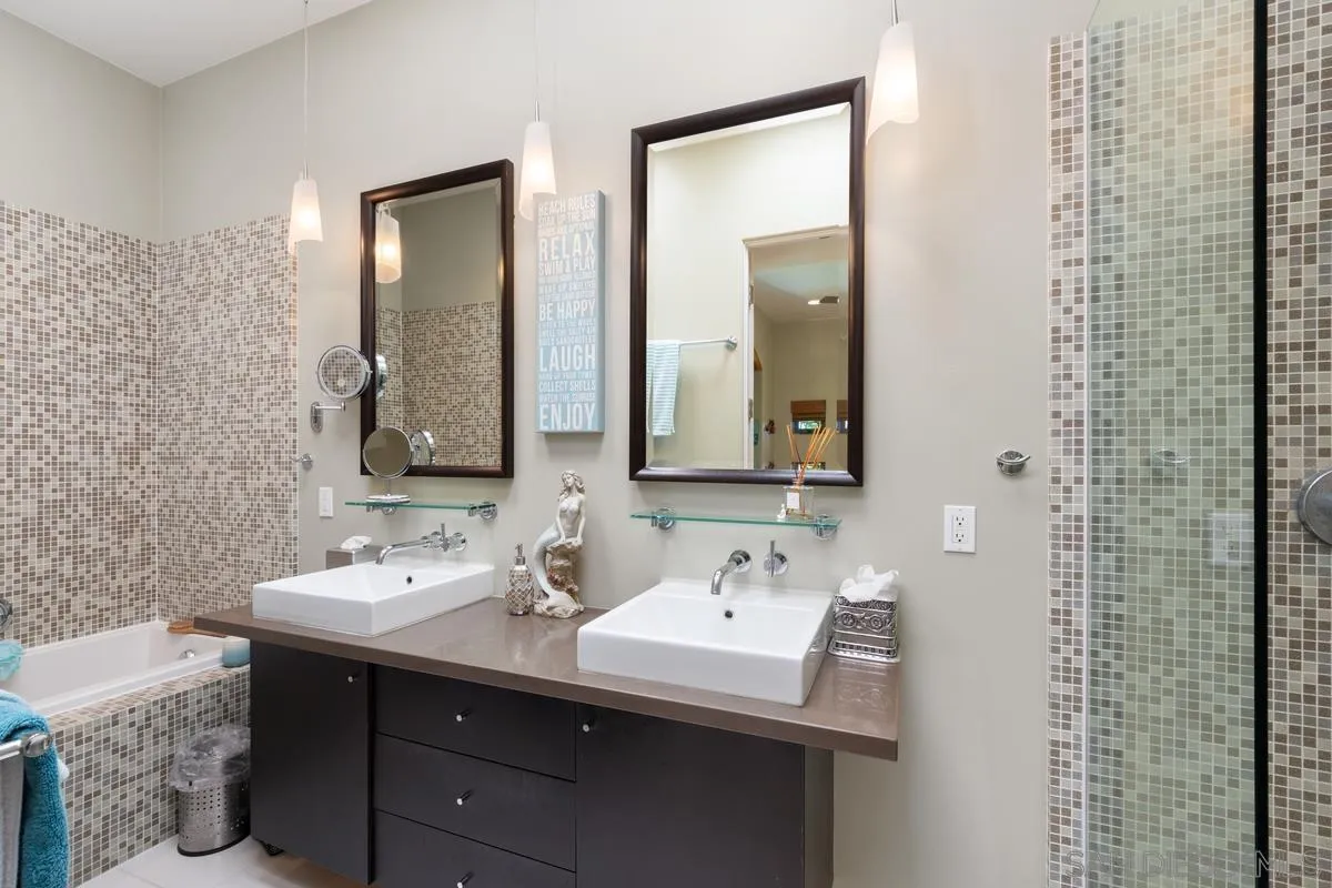 714 Bonair Way La Jolla, CA 92037 - Photo 27 of 36 a bathroom with a sink and a mirror
