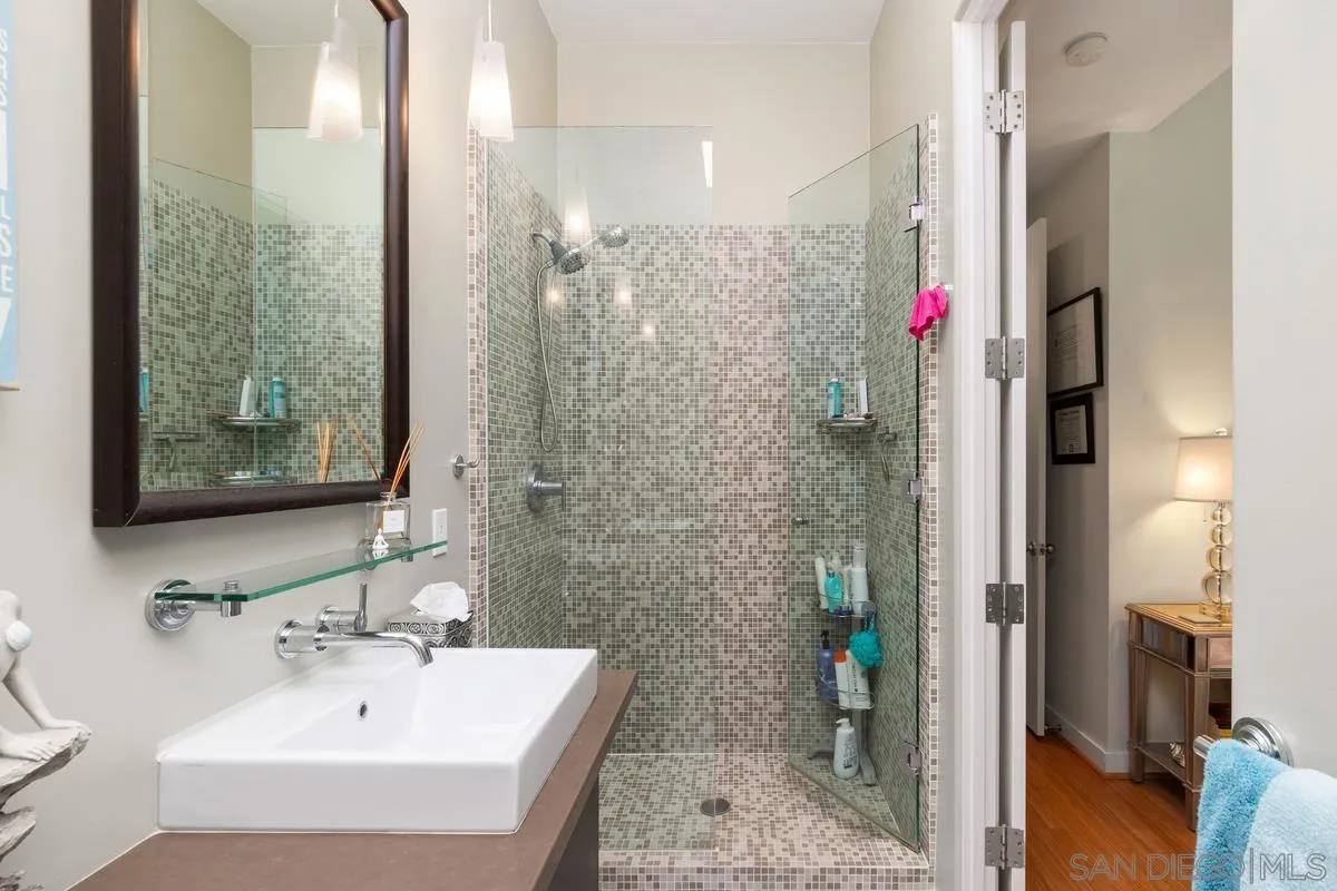 714 Bonair Way La Jolla, CA 92037 - Photo 28 of 36 a bathroom with a sink and a mirror