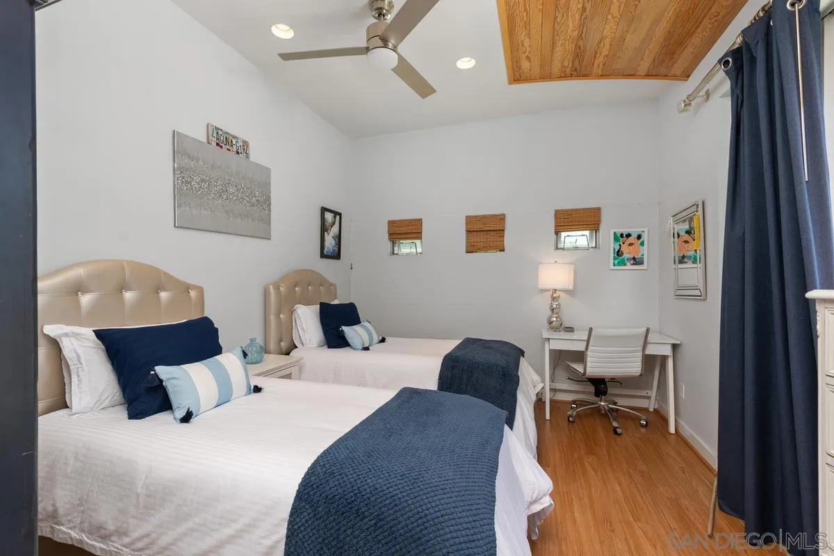 714 Bonair Way La Jolla, CA 92037 - Photo 31 of 36 a bedroom with a bed and wooden floor