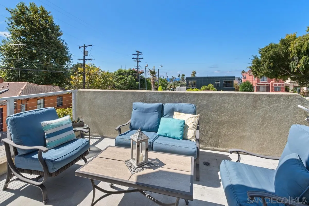 714 Bonair Way La Jolla, CA 92037 - Photo 32 of 36 an outdoor living area with furniture and a floor to ceiling window