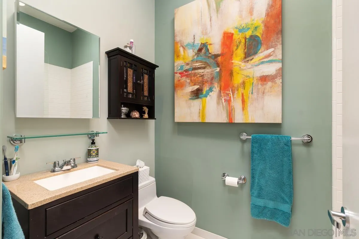 714 Bonair Way La Jolla, CA 92037 - Photo 36 of 36 a bathroom with a sink vanity mirror and toilet