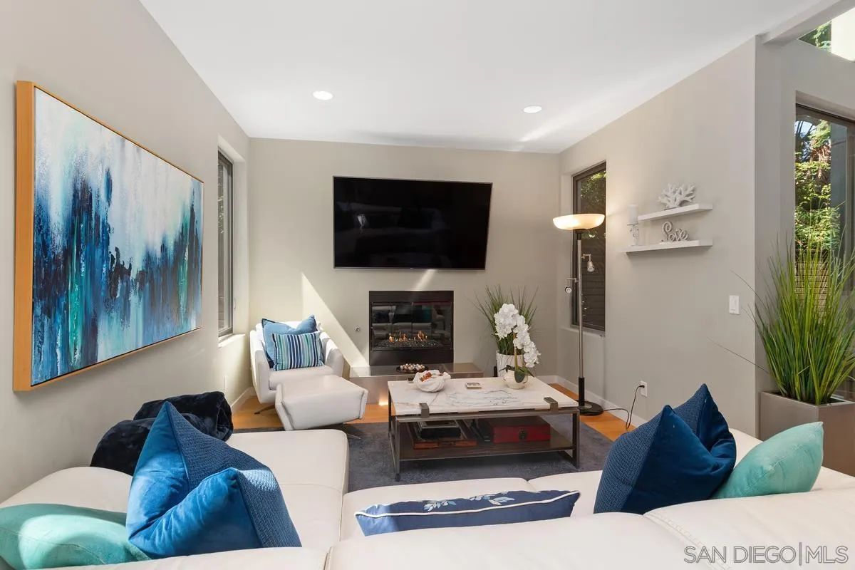 714 Bonair Way La Jolla, CA 92037 - Photo 8 of 36 a living room with furniture and a flat screen tv