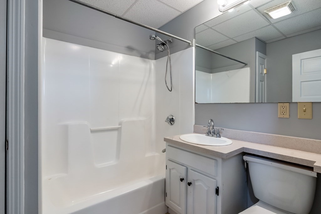 26 Kilton Street, Unit 2 Taunton, MA 02780 - Photo 15 of 20 a bathroom with a sink toilet vanity and shower