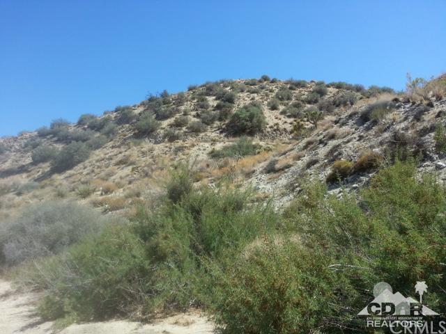 0 Pinon Drive Yucca Valley, CA 92284 - Photo 2 of 5 a view of a large building with trees in the background